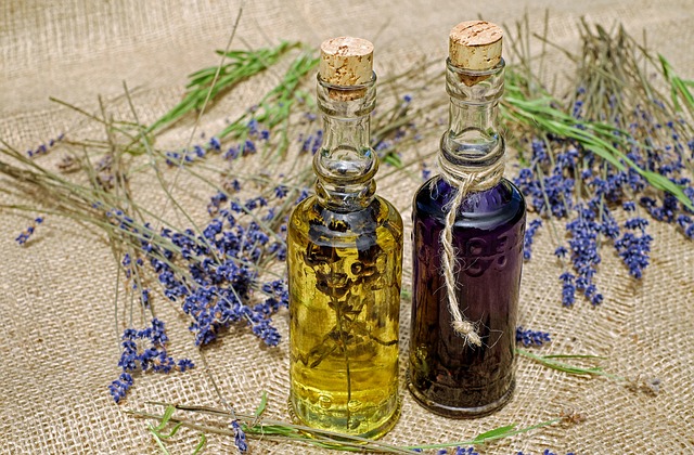 herbal essences in glass bottles with lavender sprigs
